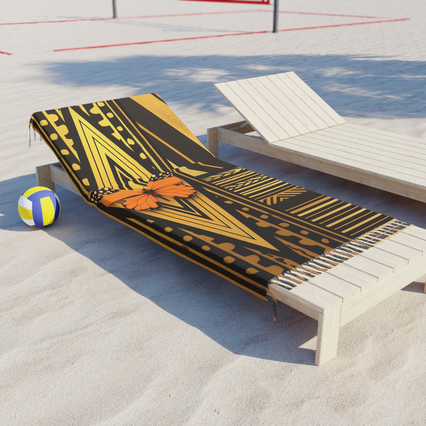 Polynesian-Inspired design Boho Beach Towel with butterfly illustration graphic resting on a beach lounge chair top angle side view